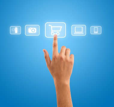 Hand pressing shopping cart symbol from media icons on blue back clipart