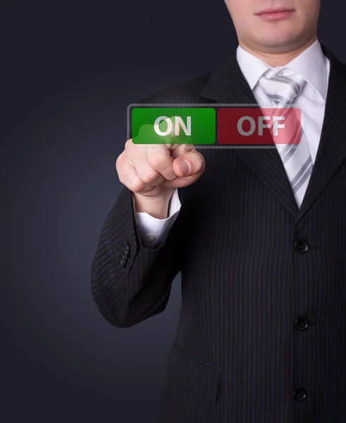 Man pressing ON / OFF button — Stock Photo, Image