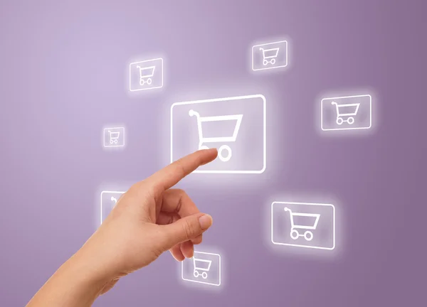 Hand pressing shopping cart icon — Stockfoto