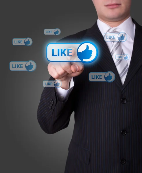 Man pressing social network button — Stock Photo, Image