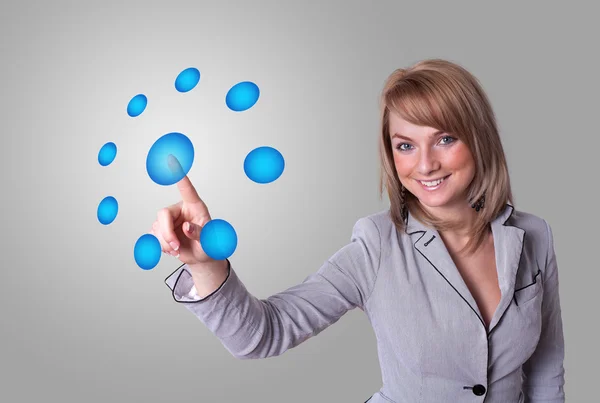 Woman pressing digital buttons — Stock Photo, Image