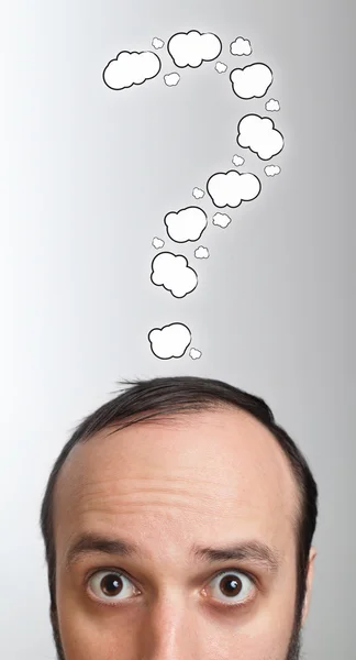 Young guy with question mark over his head — Stock Photo, Image