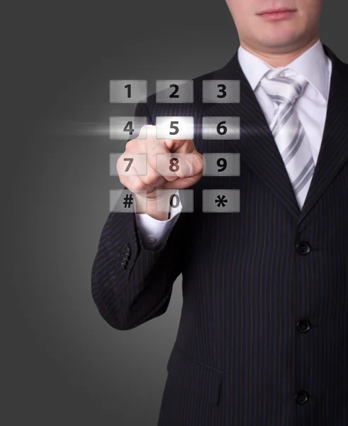Man pressing digital buttons — Stock Photo, Image