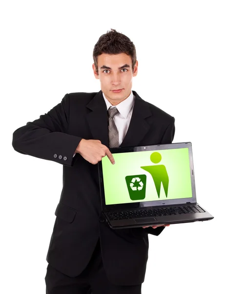Uomo d'affari che punta a un computer portatile con icona di riciclaggio — Foto Stock