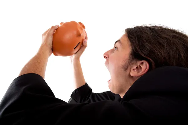 A guy finding treasure coins in a piggy bank — Stock Photo, Image