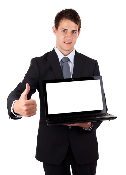 Jovem empresário segurando laptop com polegares para cima — Fotografia de Stock