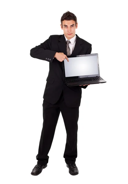 Hombre de negocios apuntando a un ordenador portátil —  Fotos de Stock