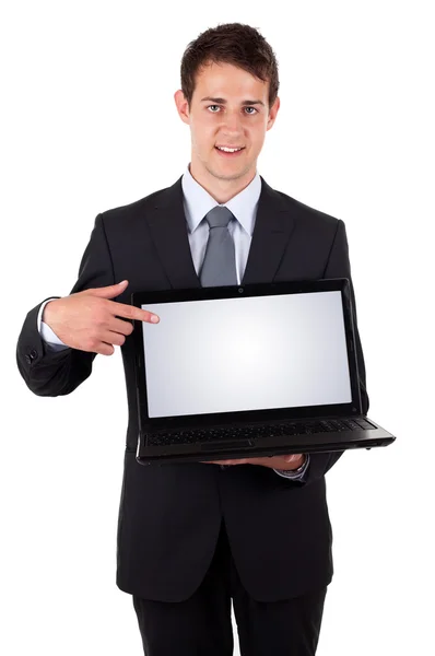 Hombre de negocios apuntando a un ordenador portátil —  Fotos de Stock