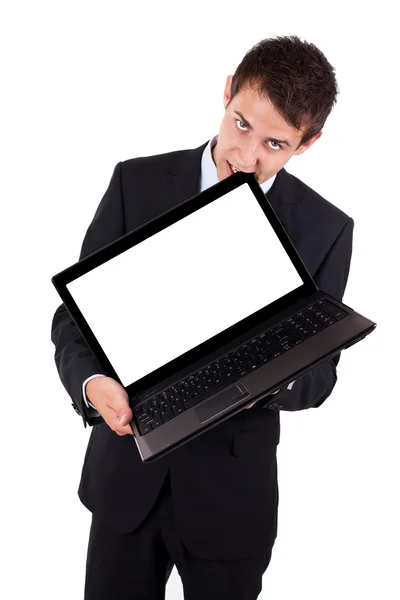 Разгневанный бизнесмен кусает ноутбук — стоковое фото