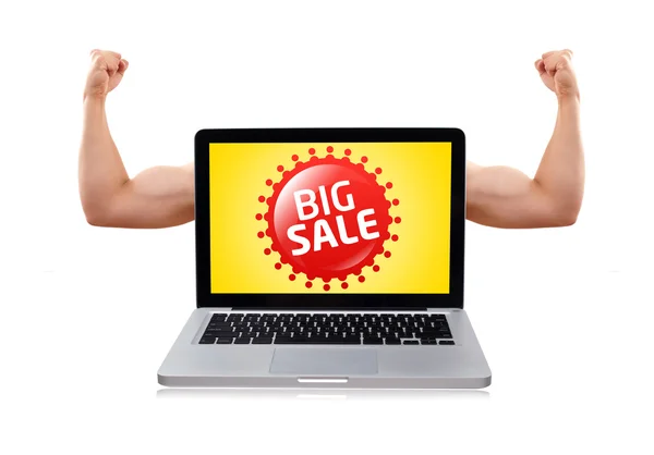 Přenosný počítač s pěkně svalnaté biceps a velký prodej znamení — Stock fotografie