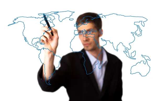 Бизнесмен рисует карту мира на белой доске — стоковое фото