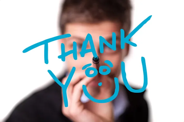 Young man writing Thank YOU on whiteboard — Stock Photo, Image