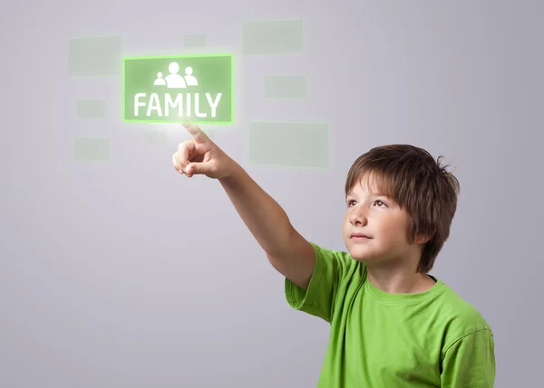 Niño tocando el botón FAMILIA —  Fotos de Stock