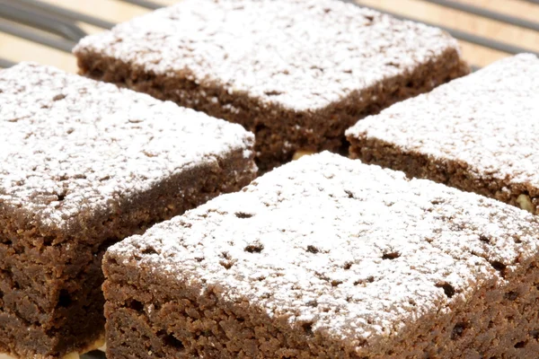 stock image Chocolate brownies with powdered sugar on top