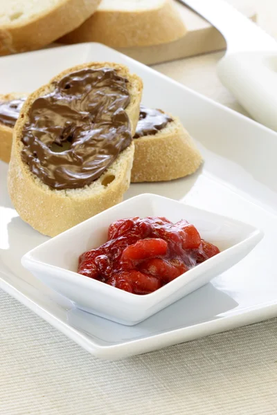 Delicious hazelnut spread and fresh jelly sandwich — Stock Photo, Image