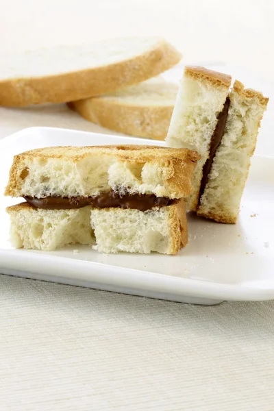 Delicious hazelnut and chocolate spread sandwich — Stock Photo, Image