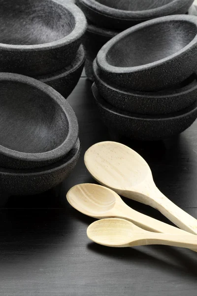 Plastic molcajetes and wood spoons — Stock Photo, Image