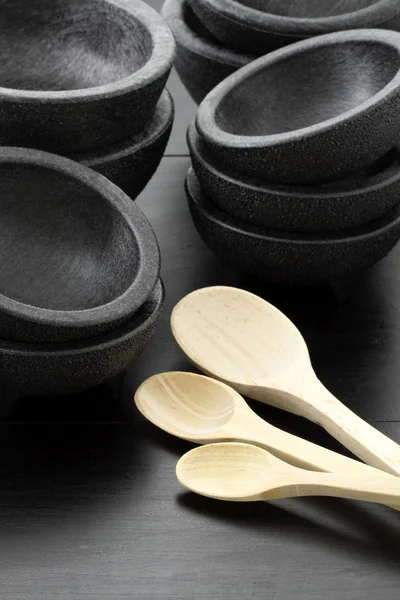 Plastic molcajetes and wood spoons — Stock Photo, Image