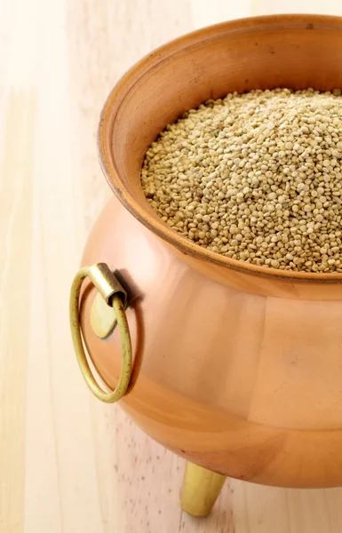 stock image Raw quinoa on copper pot