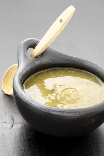 Stock image Tomatillo sauce in colombian clay dish