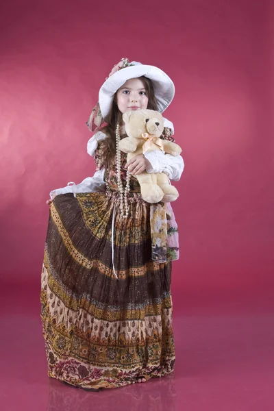 stock image Portrait of the little girl, with a toy in hands