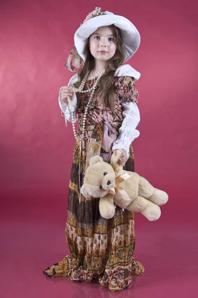 Portret dziewczynki, z zabawkami w rękach — Zdjęcie stockowe