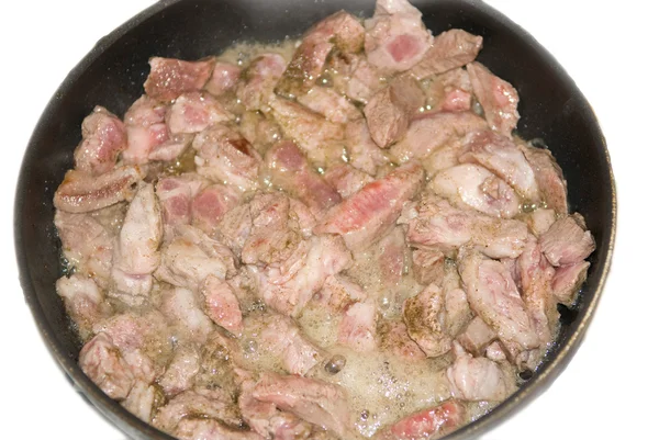 Carne cruda en una sartén — Foto de Stock