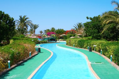 Long swimming pool at the hotel clipart