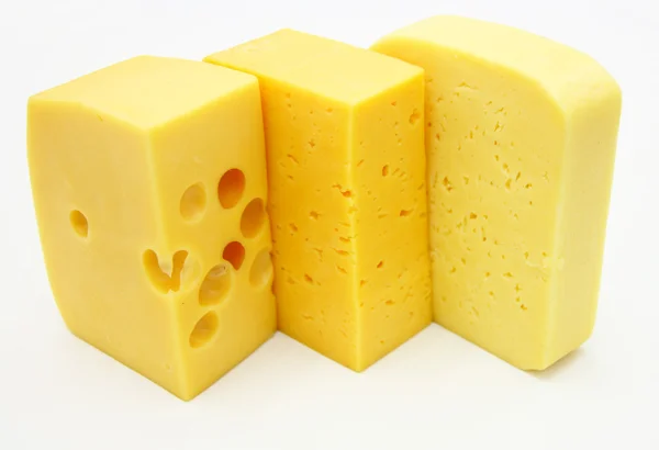 Three pieces of different kinds of cheese — Stok fotoğraf
