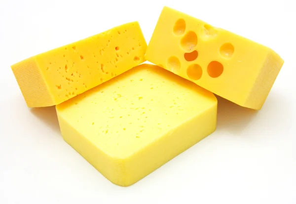 Три шматки різних видів сиру — стокове фото