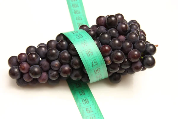 Fita métrica em torno de uvas — Fotografia de Stock