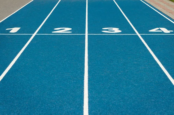 Blue running track — Stock Photo, Image