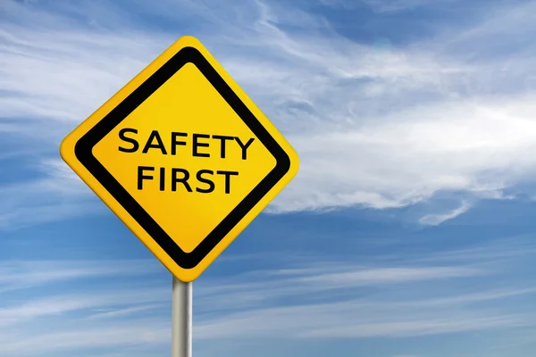 Safet First road sign against blue sky — Stock Photo, Image
