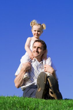 Family, father, and child playing outdoors clipart