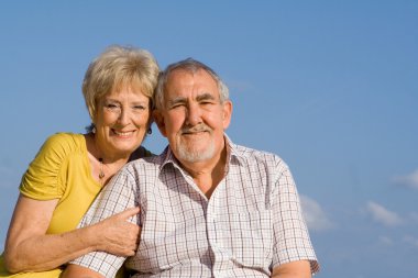 Elderly couple on vacation clipart