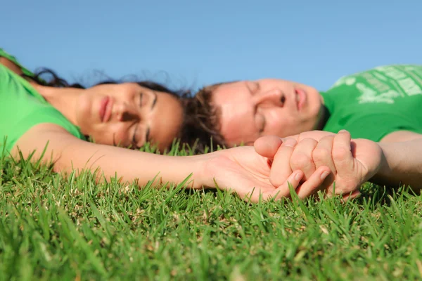 Sleeping couple , focus on holding hands, — Stock Photo, Image