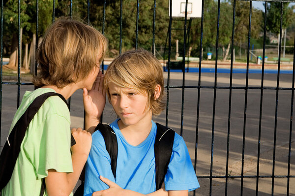 School kids whispering problems