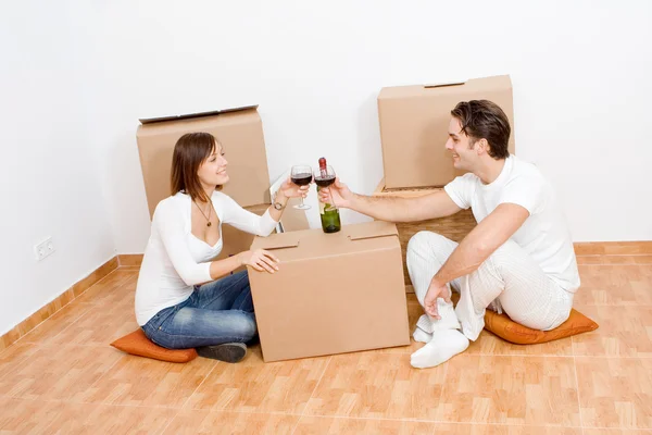 Happy couple celebrating new first home — Stock Photo, Image