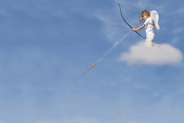 Cupid firing arrow from cloud for valentines day — Stock Photo, Image