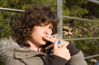 Teen girl smoking cigarette clipart