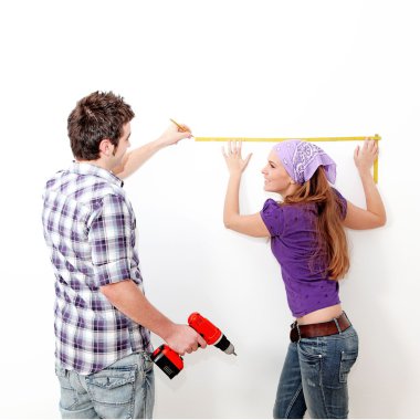 Home improvements, couple with drill clipart