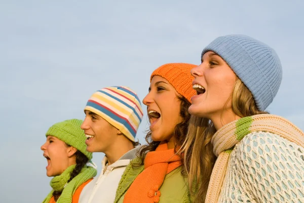 Grupp av carolers eller carol sångare sjunger eller sport åskådare heja — Stockfoto