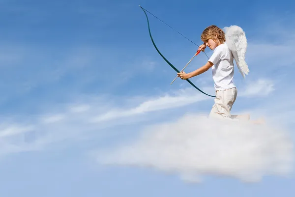 Valentines day concept, cupid on cloud, shooting arrow — Stock Photo, Image