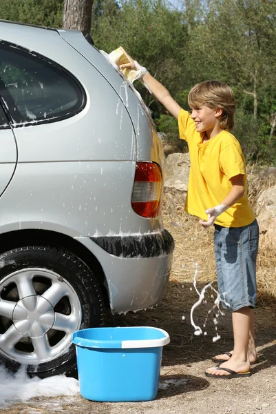Kid playing having fun cleaning or washing car — Stock Photo, Image