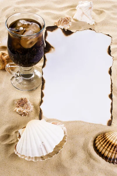 Burned paper with shells and drink — Stock Photo, Image