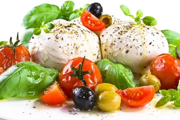 Mozzarella with basil cherry tomatoes and olives — Stock Photo, Image