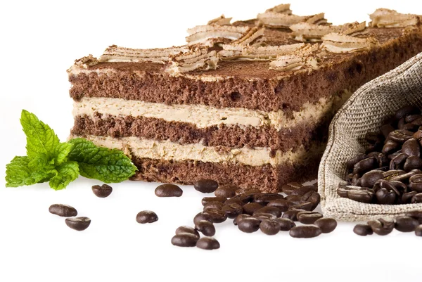 Tiramisu cake with bag of coffe — Stock Photo, Image