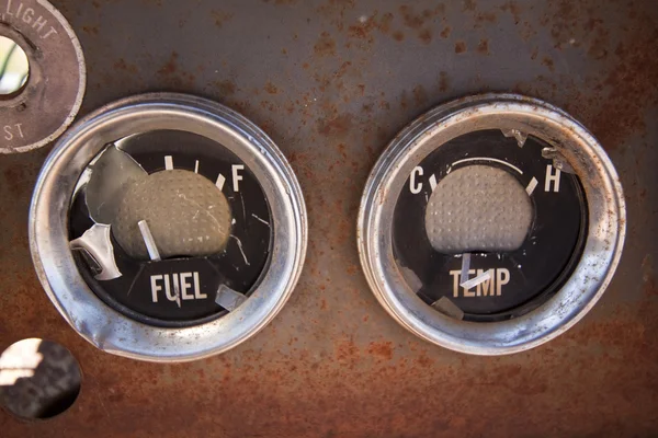 Old rusty guages fuel temp round abandoned instrument dashboard — Stock Photo, Image