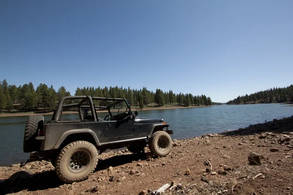 stock image 4x4 offroad adventure by a lake in the sierras