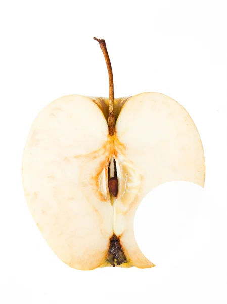 Половина желтого яблока с дыркой сбоку — стоковое фото